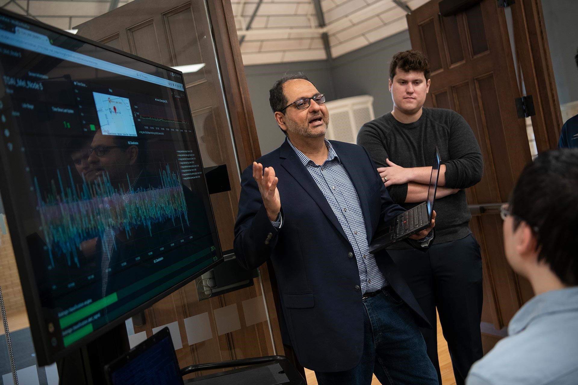 Dr. Ness Shroff addresses a small group of students