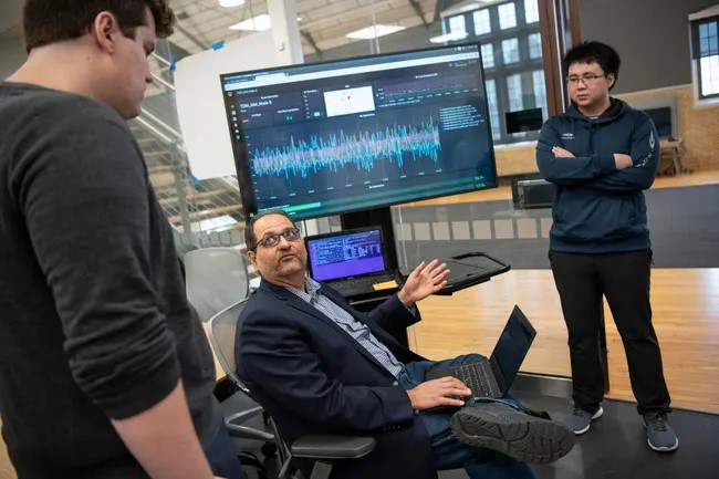 Dr. Ness Shroff talking to students